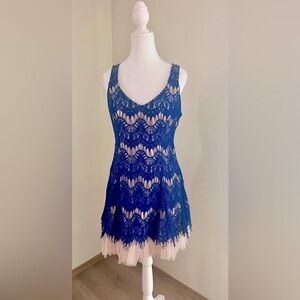 Party dress in royal blue lace overlay.